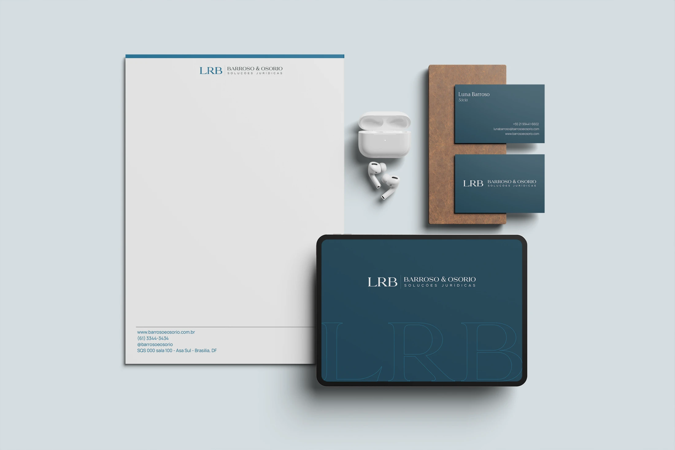 Full LRB stationery: letterhead, business cards and a tablet with the brand over navy